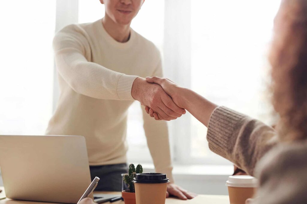 Two people greeting.