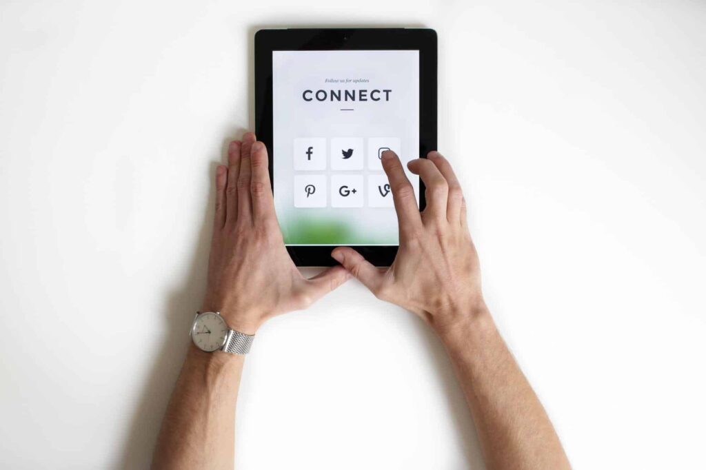 A person holding a tablet.